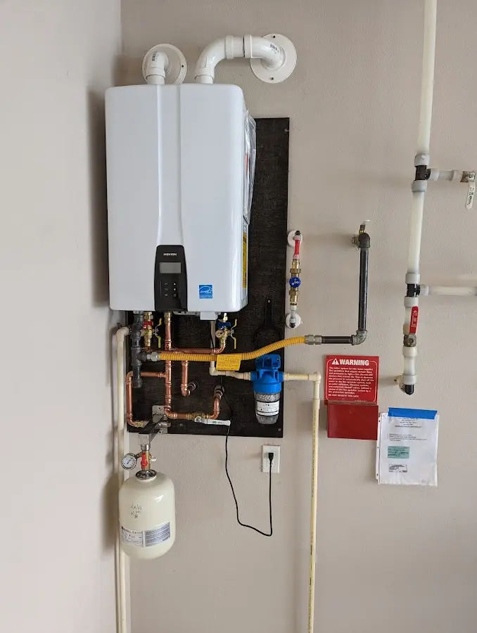 Professional plumber installing copper piping in a Bridgewater home